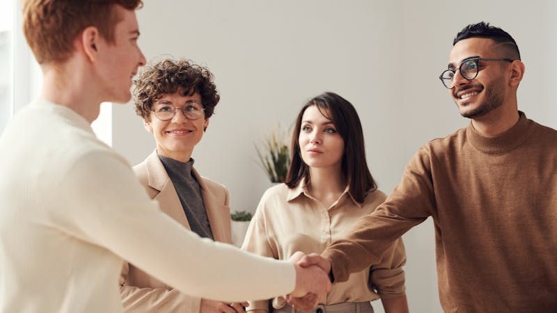 Therapy session with diverse counselor and client